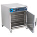 An Alto-Shaam undercounter cook and hold oven with a door open and a rack inside.