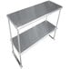 A stainless steel double deck overshelf on a metal table.