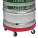 A silver and green DeVault keg on a red and black rolling cart.