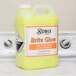 A close up of a jug of Noble Chemical Brite Glow laundry emulsion.