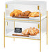 A Cal-Mil glass pastry case with a brass frame filled with pastries and croissants.