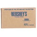 A brown Hershey's caramel topping box with blue text.
