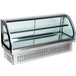 A Vollrath curved glass drop in refrigerated countertop display case with a glass door.