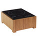 A Cal-Mil bamboo stand with a black induction cooker on top.