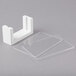 A white rectangular Cal-Mil tabletop card holder with clear plastic sheets.