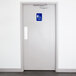 A white door with a blue and white Thunder Group Women's Restroom sign.