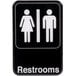 A black and white restroom sign with a man and woman symbols.