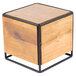 A wooden cube with black metal legs.