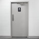 A grey bathroom door with a black and white Thunder Group ADA Men's Restroom Sign with Braille on it.