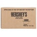 A brown Hershey's box with black text reading "Special Dark Fudge Topping" on a brown surface.