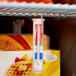 A Taylor refrigerator / freezer thermometer hanging from a shelf.