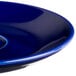 A Tuxton cobalt blue china saucer with a rim.