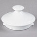 A white round lid for a Tuxton teapot with a small round knob on top.