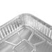 A Durable Packaging aluminum foil cake pan with a lid on it.