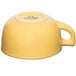 A yellow Tuxton jumbo cappuccino cup with a handle.