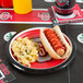 A red and yellow Ohio State University paper plate with a hot dog, ketchup, and macaroni and cheese.