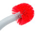 A red and white Unger Ergo toilet bowl brush with a red handle.