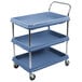 A slate blue Metro utility cart with three deep plastic shelves and wheels.