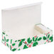 An open white Holly candy box with holly leaves on it.