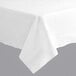 A white Hoffmaster tablecloth with a folded edge on a table.