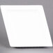 A CAC white porcelain square plate with a square edge on a gray surface.