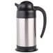 A stainless steel carafe with a black handle.