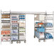 A Metro chrome-plated mobile shelving unit with shelves holding many items.