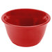 A close-up of a Thunder Group Pure Red Melamine Bouillon Cup with a handle.