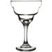 A close-up of a clear Libbey margarita glass with a rim.