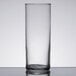 A close up of a clear Libbey straight sided glass on a table.