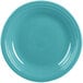 A close-up of a Fiesta® turquoise dinner plate with a white rim.