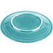 A turquoise Fiesta dinner plate with a white rim.