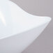 A close-up of a white GET San Michele flare bowl with a curved edge.