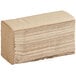 A large stack of Lavex brown multifold paper towels.
