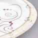 A close up of a white Solo paper plate with swirl designs.