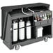 A black Cambro portable bar with bottles and cans on it.