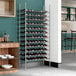 A Regency wire wine rack filled with bottles.