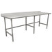 A stainless steel Advance Tabco work table with a white surface on an open base with legs.