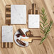 A brown faux hickory wood rectangular serving board with a carrara marble insert and handle.