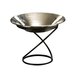 A silver bowl on an American Metalcraft wrought iron stand.