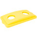 A yellow rectangular plastic lid with two holes, one white circle and one rectangular.
