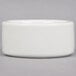 An American Metalcraft white porcelain salt and pepper dish on a gray surface.