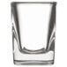 A close-up of a clear Libbey Prism square shot glass.