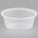 A clear Pactiv oval souffle container with a clear lid.