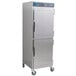 An Alto-Shaam stainless steel holding cabinet on wheels with a Dutch door.