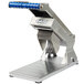 A metal and blue Edlund ARC manual fruit and vegetable slicer.