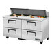 A True stainless steel refrigerated sandwich prep table with drawers.
