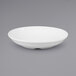 A white GET Diamond White deep bowl on a gray surface.