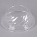 A clear plastic Fabri-Kal dome lid on top of a clear plastic bowl.