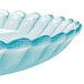 A close-up of a jade polycarbonate deep plate with a scalloped edge.